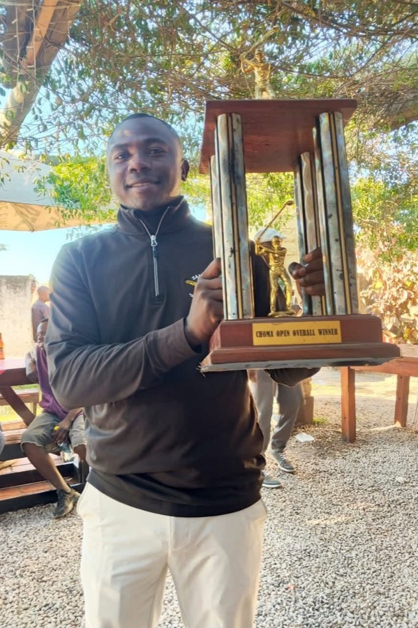 A player holding the tour trophy